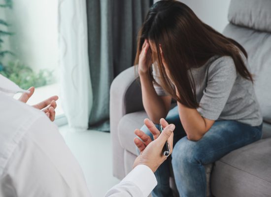 Professional psychologist doctor consulting his depressed patient